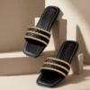 Elegant Black Braided Flat Slippers with Golden Detailing – Casual & Chic Footwear